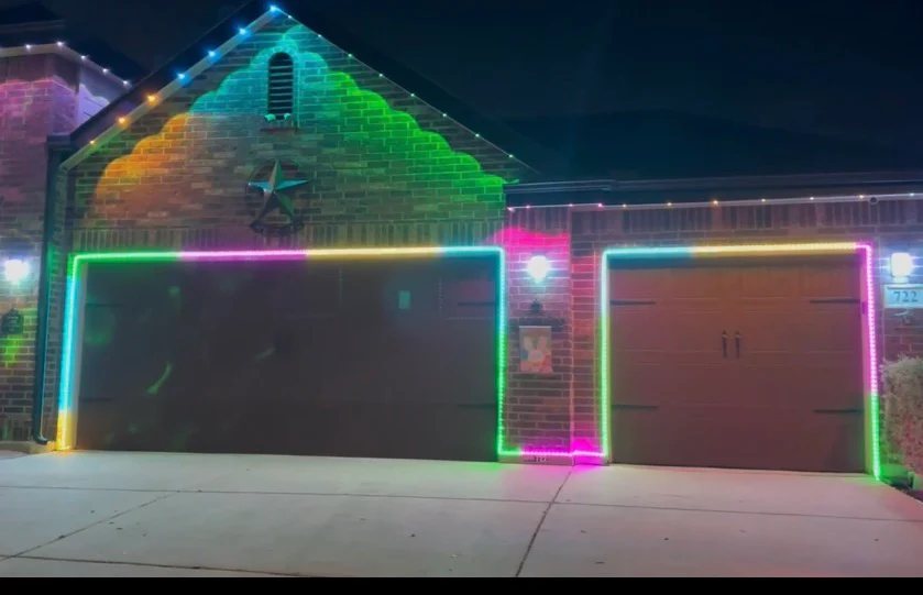 Garage outlined in animated rainbow smart lighting